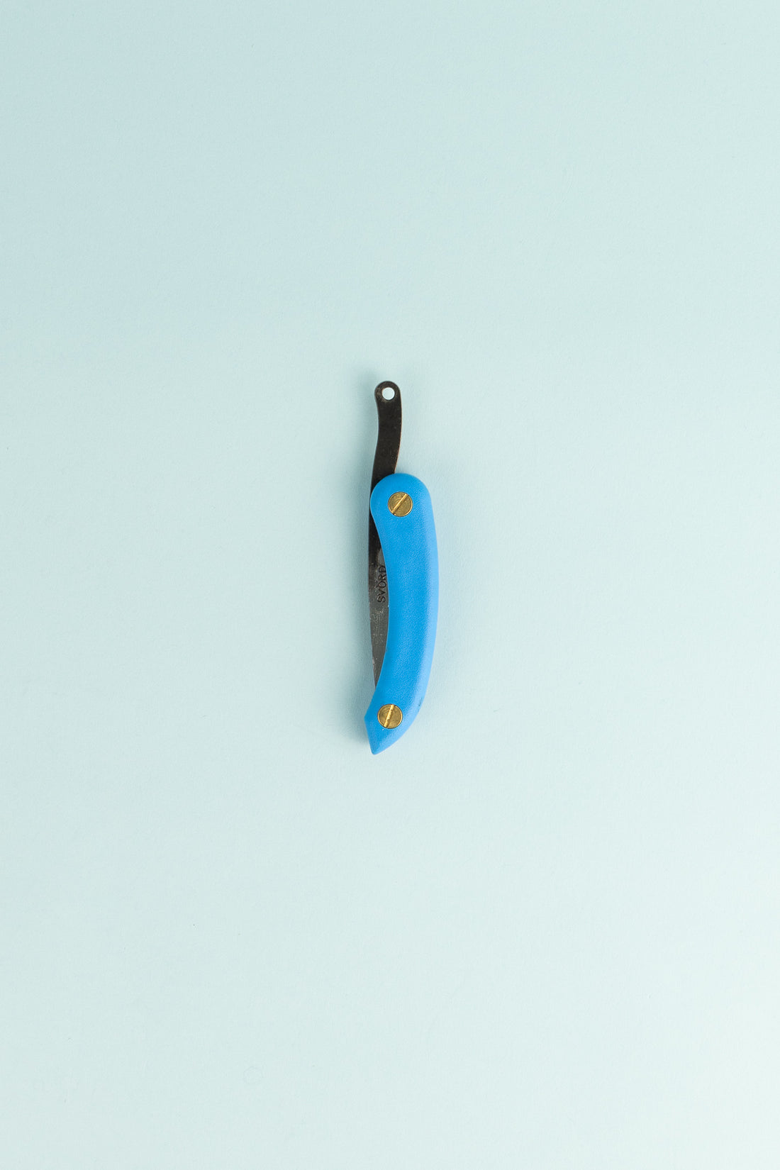 Peasant Knife Mini - Blue laid on a light background showcasing its craftsmanship and unique design features.