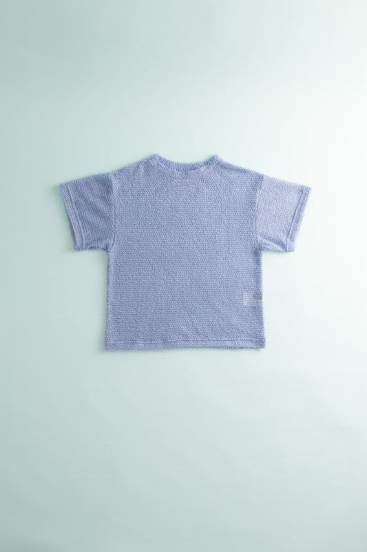 Back view of the Shag Tee v2.0 in light purple, lightweight and stylish baselayer hoodie.