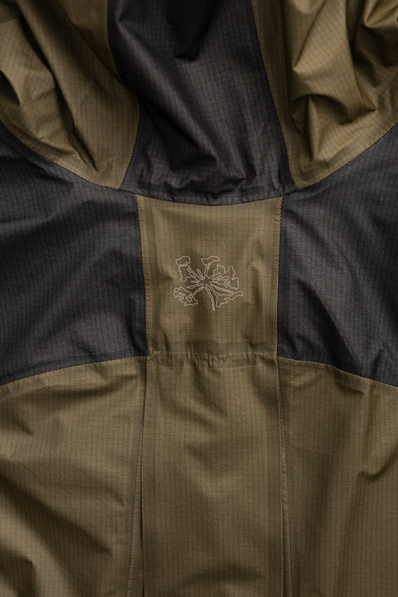 Close-up of the Sphere LT GORE-TEX Jacket showcasing the ergonomic design and fabric details in dark olive color.