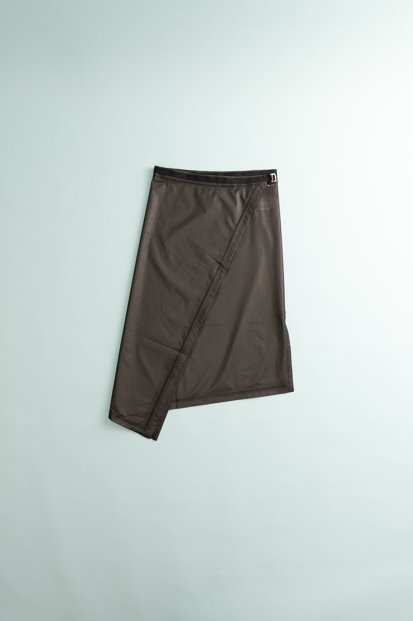 The Orange Square - True Black waterproof unisex shell skirt with wraparound design and slit for freedom of movement.