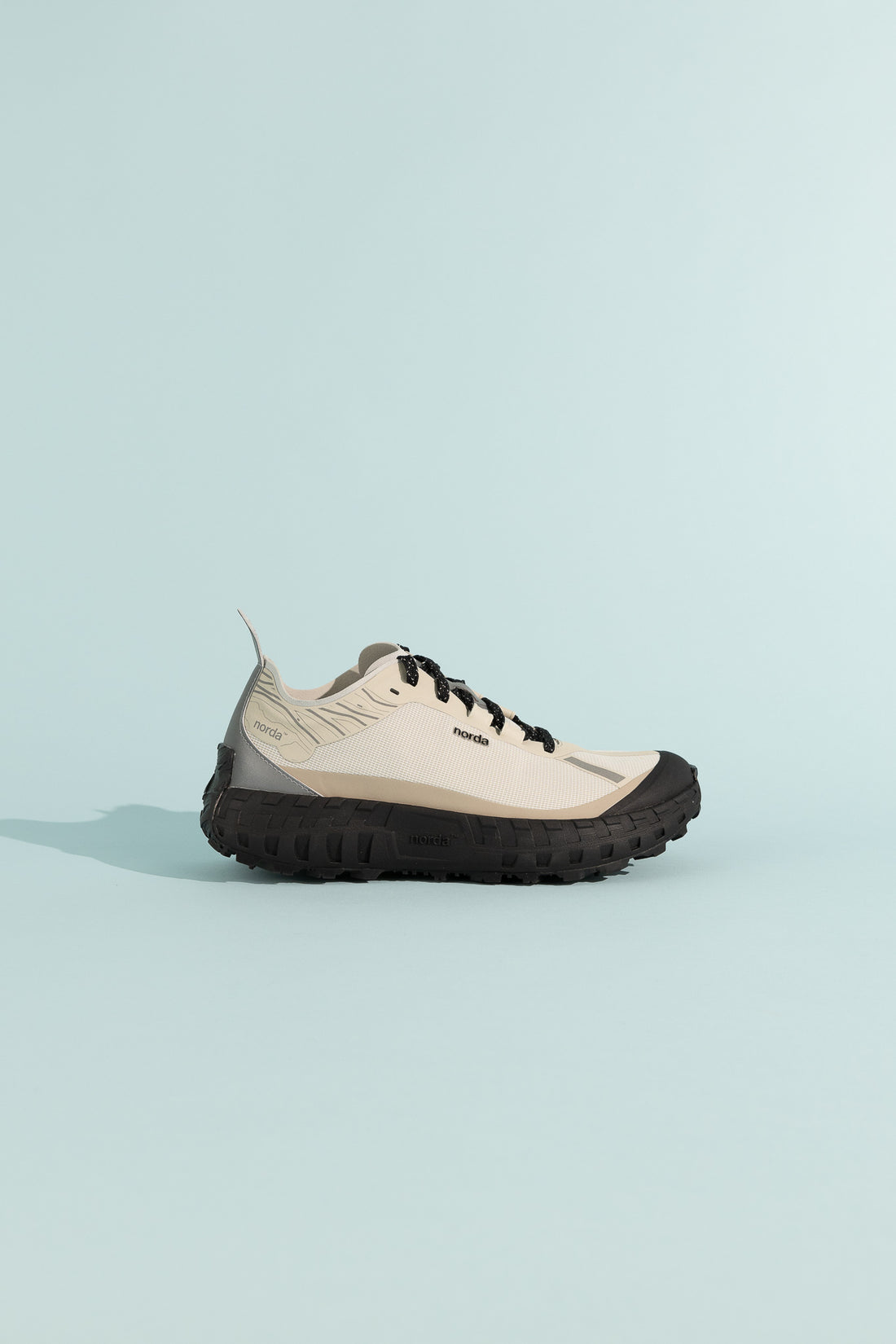 001A - Cinder shoe featuring a lightweight design and durable midsole technology for superior comfort.