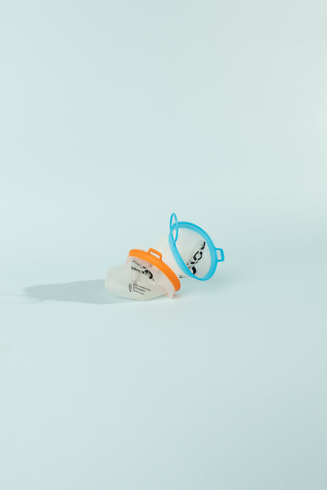 Curn Ultralight Cups - a pair of collapsible cups in orange and blue, designed for outdoor use.