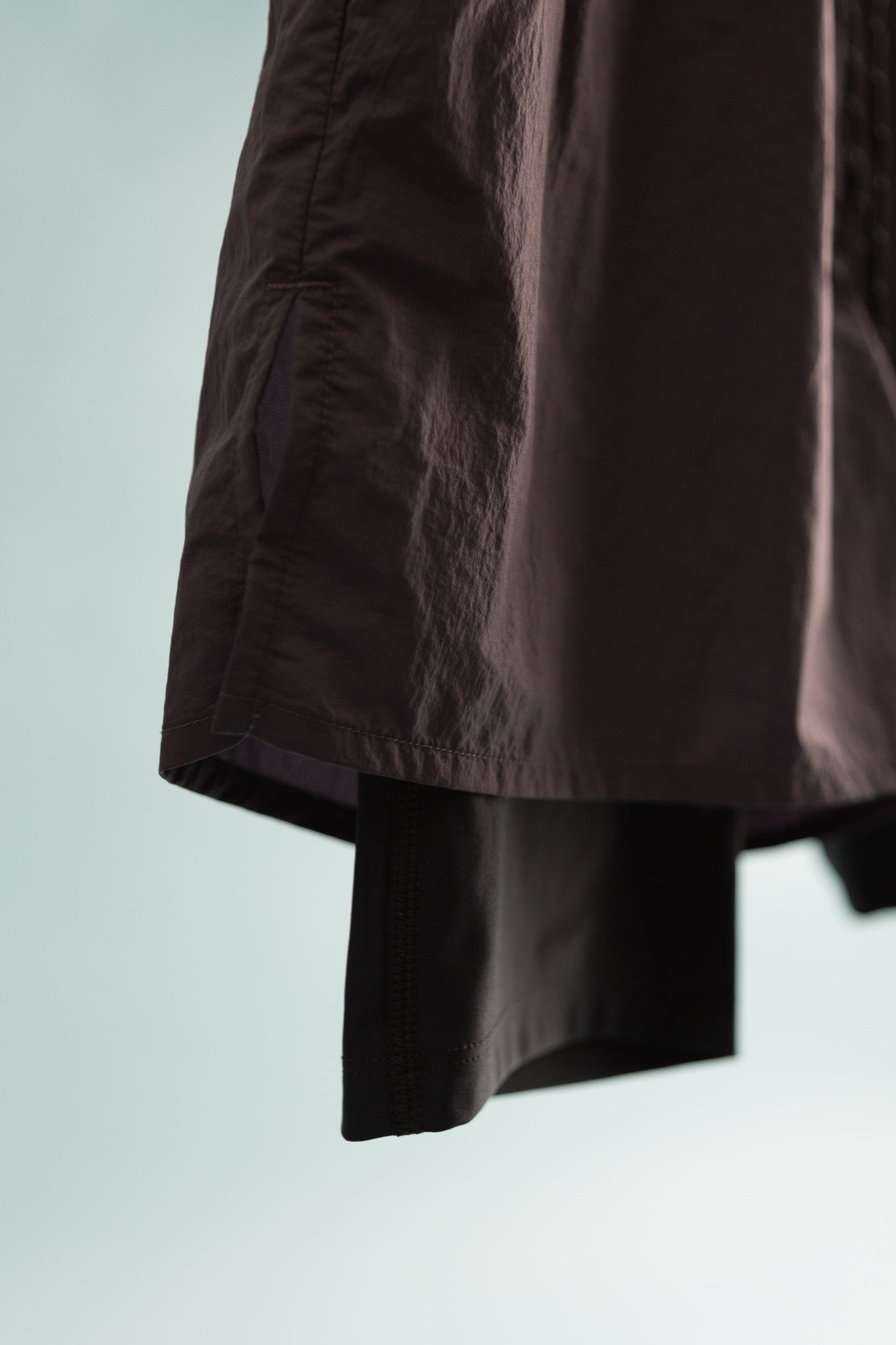 District Vision Mens Ultralight Nylon Trail Shorts in Nightshade and Black hanging with fine detail.