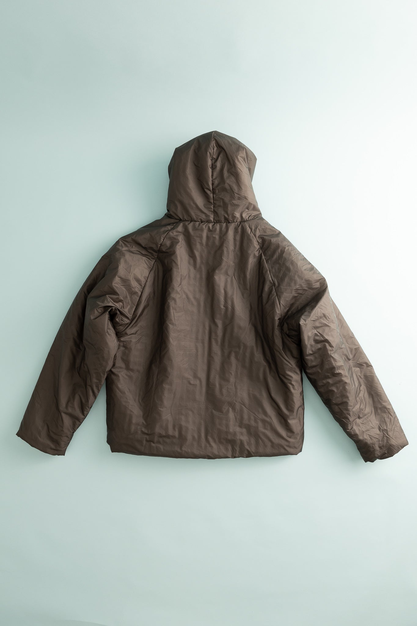 Back view of the Heatwave Puffer Jacket in Major Brown, showcasing its lightweight and stylish design.