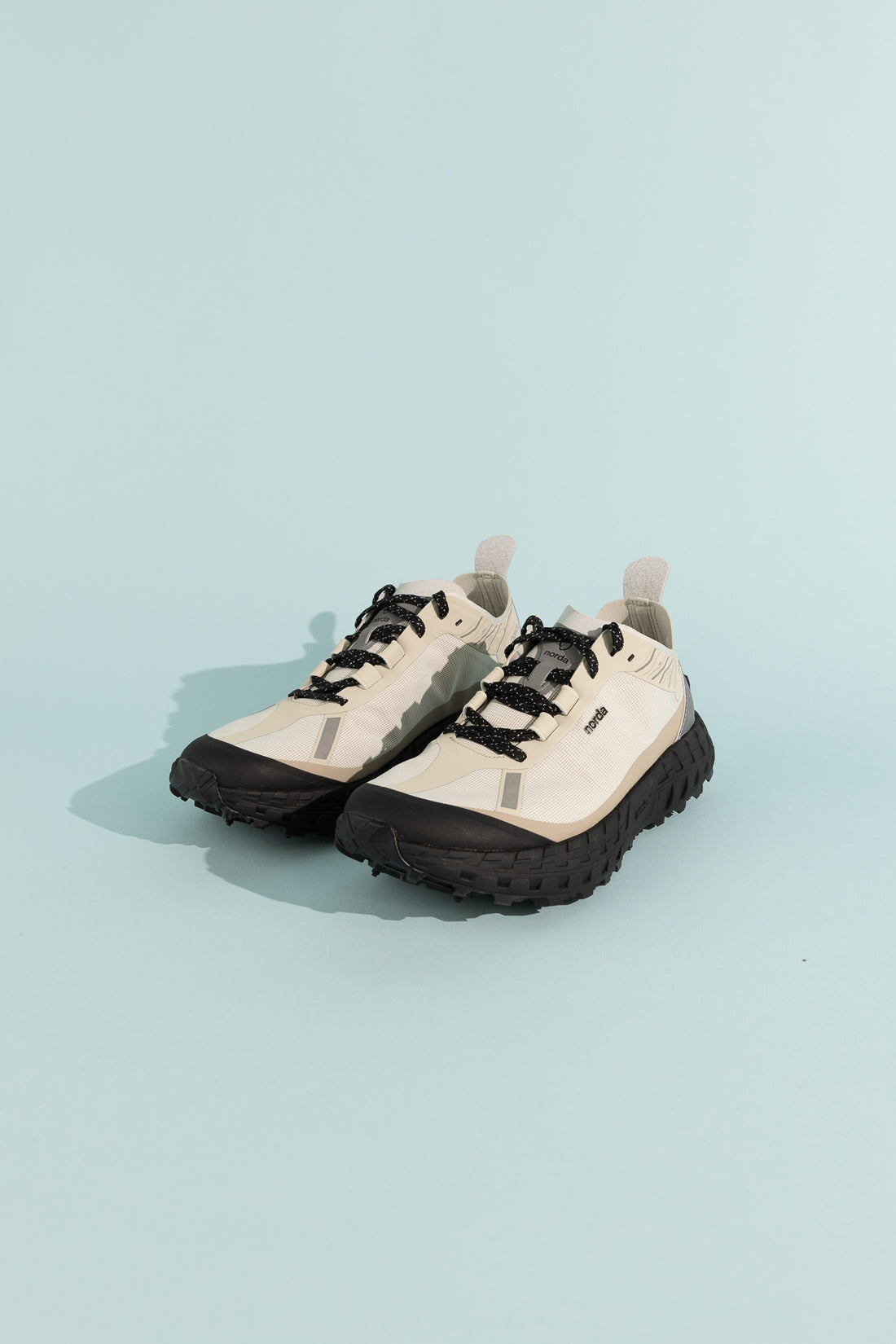 001A - Cinder shoes with sleek design, black laces, and durable sole, showcasing modern athletic style.