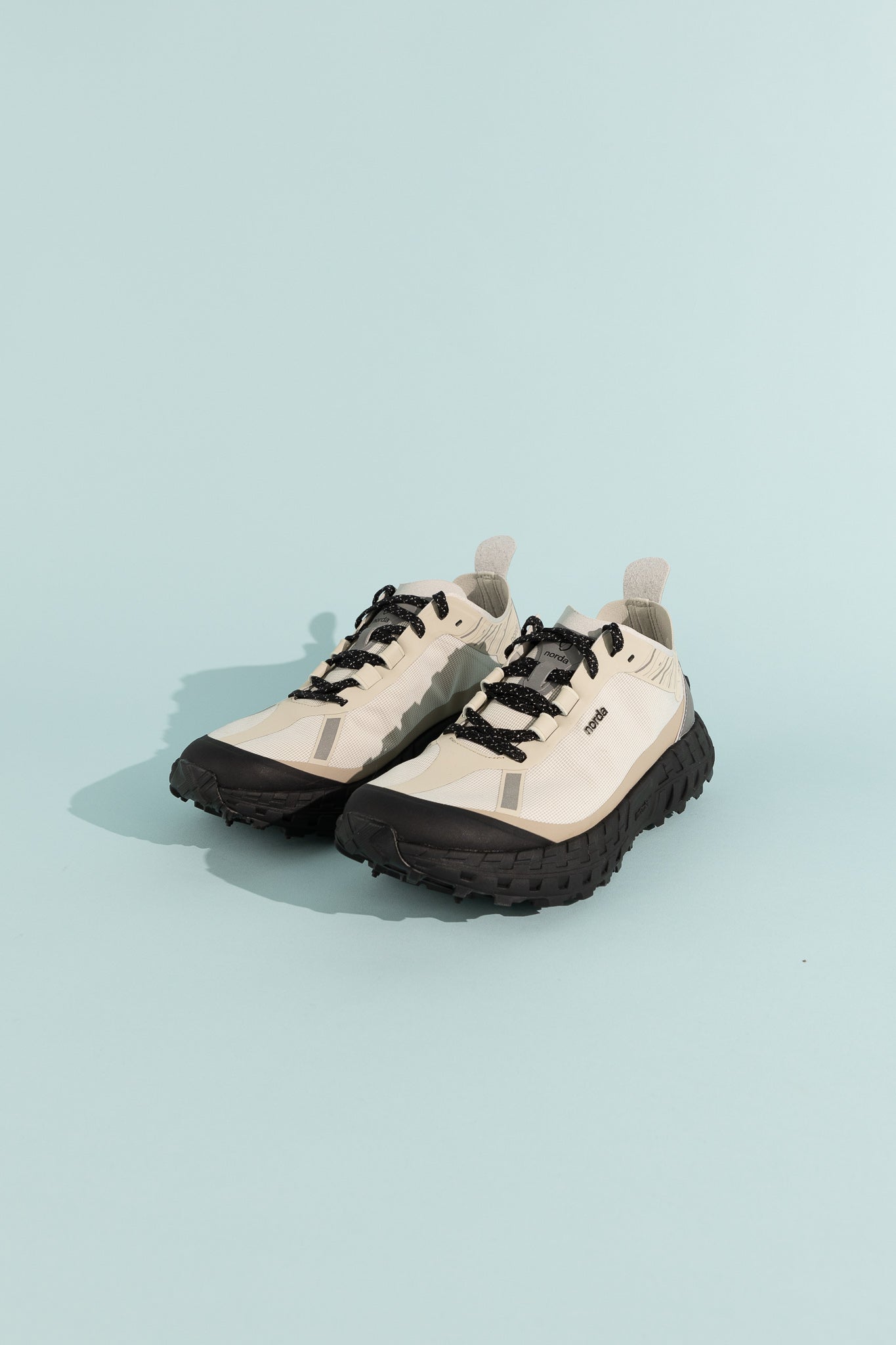 001A - Cinder shoes with sleek design, black laces, and durable sole, showcasing modern athletic style.