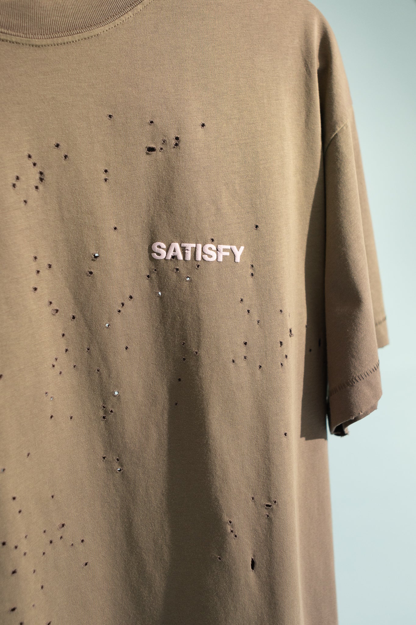 MothTech T-Shirt in sun bleached falcon color featuring ventilation holes and Satisfy logo.