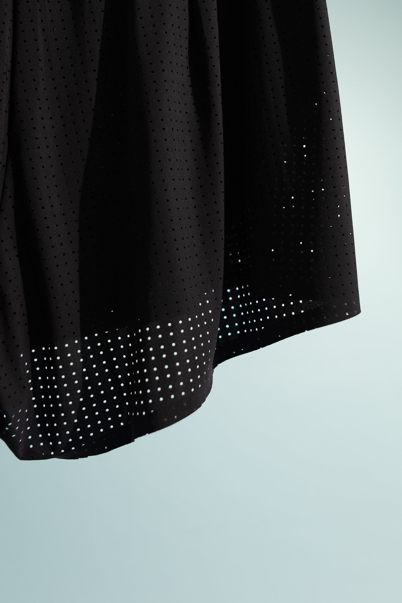 Close-up of Mens Space-O™ 2.5" Shorts in black with perforated micro jersey fabric for breathability.
